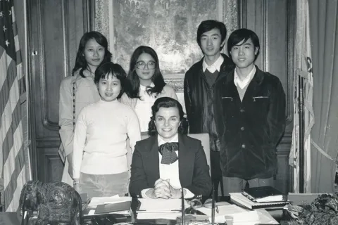 Woman with Asian students