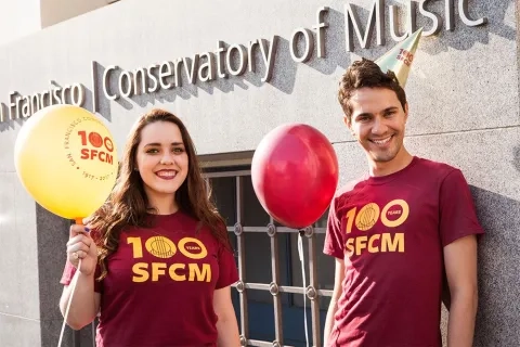 Students in SFCM centennial gear