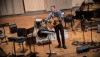 A man plays an acoustic guitar for Winter Term 09